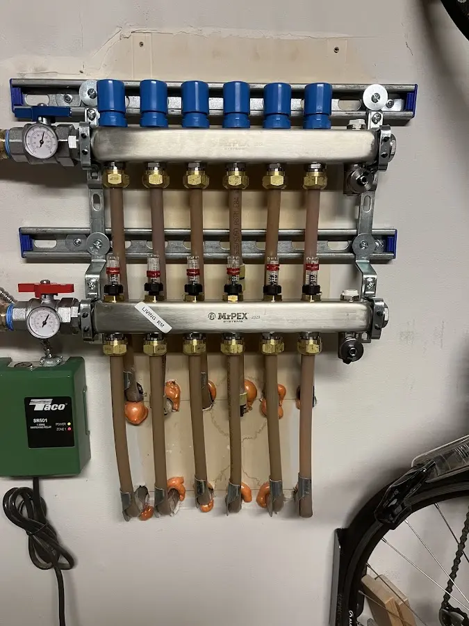 Plumber performing Water Heater Repair at a residential property in Oconomowoc